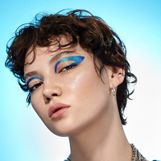 A model wearing Hypnotic Color Cream Multichrome Eyeshadow in Moondance.