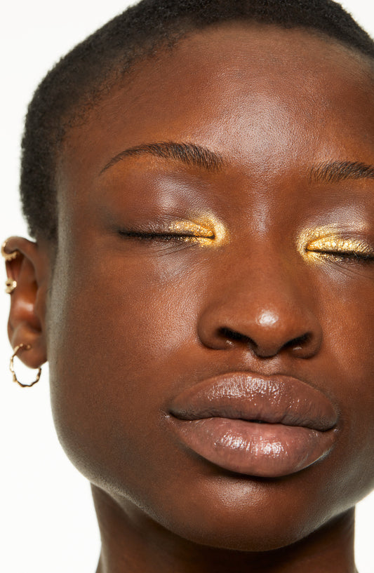 Model wears Freestyle Color Cream in Real Fake as an inner eye burst of gold